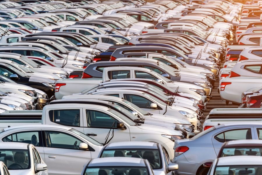 Row of new cars in port.